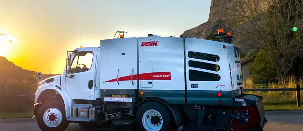 Elgin Broom Bear mechanical street sweeper designed for efficient debris collection and municipal roadway cleaning.