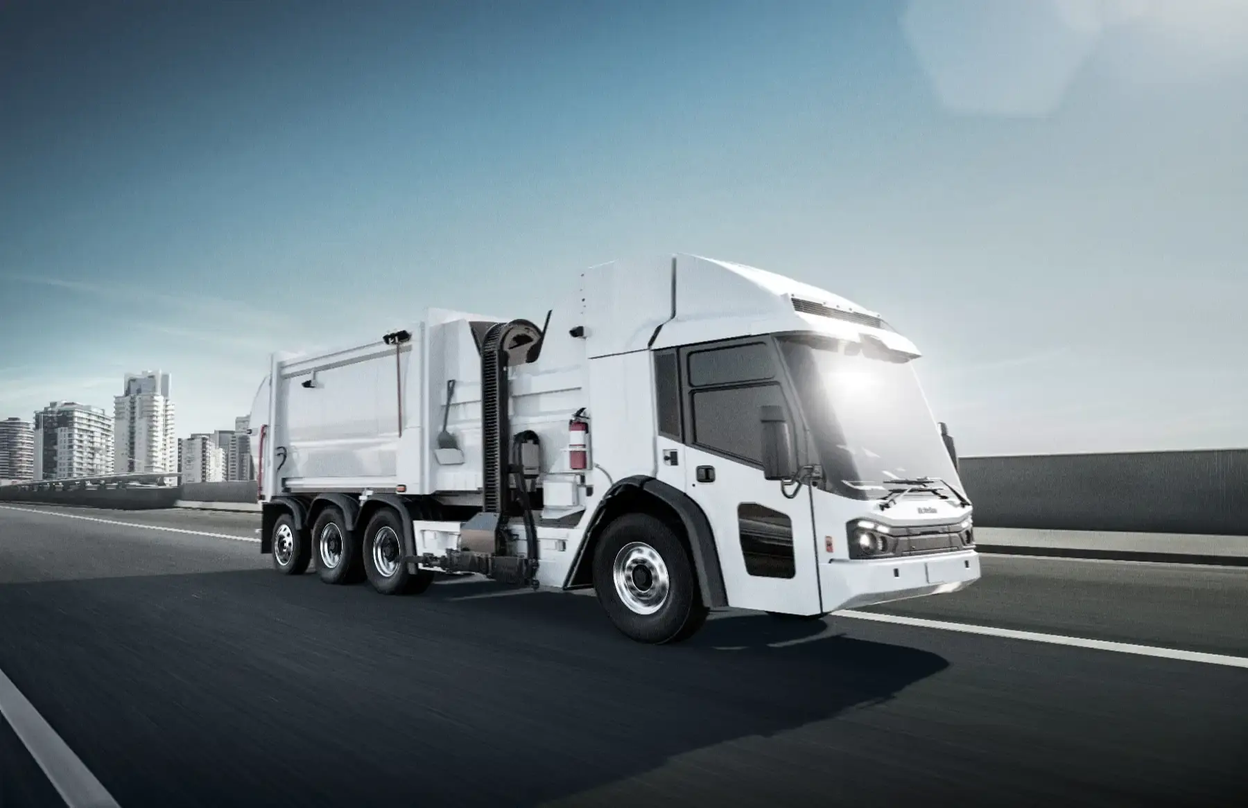 Next-generation electric refuse truck driving through an urban environment, delivering sustainable, zero-emissions waste collection and sanitation services.