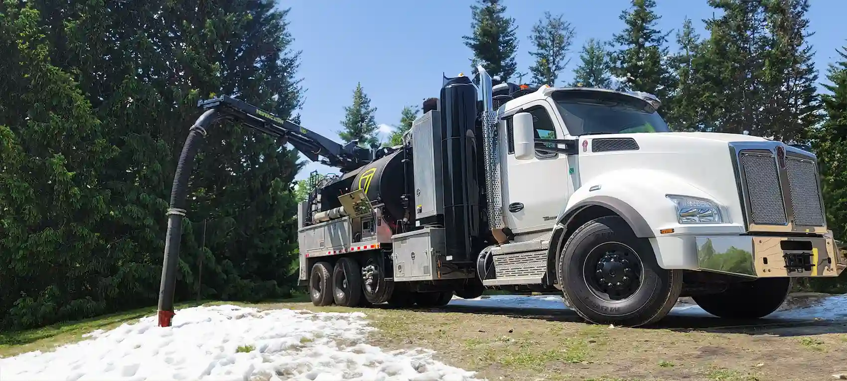 TRUVAC HXX hydro excavation truck positioned outdoors, showcasing its vacuum excavation system and debris tank designed for safe, non-destructive digging operations.