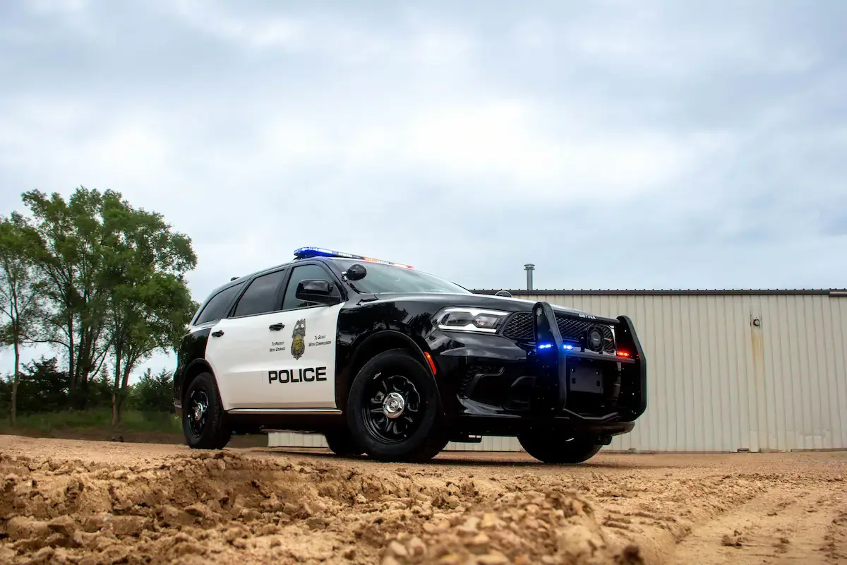 Law enforcement vehicle equipped with emergency lighting, communications equipment, and operational support features.