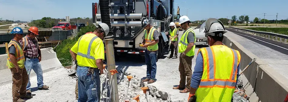 Construction crew working on a demolition project, using equipment and tools to safely remove structures and prepare the site.